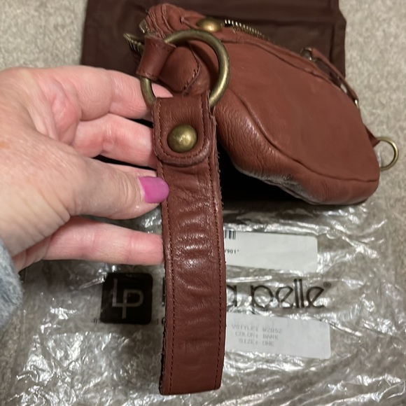 New, LINEA PELLE leather wristlet. Inside zip pocket, front zip, and top zip. - Picture 7 of 7